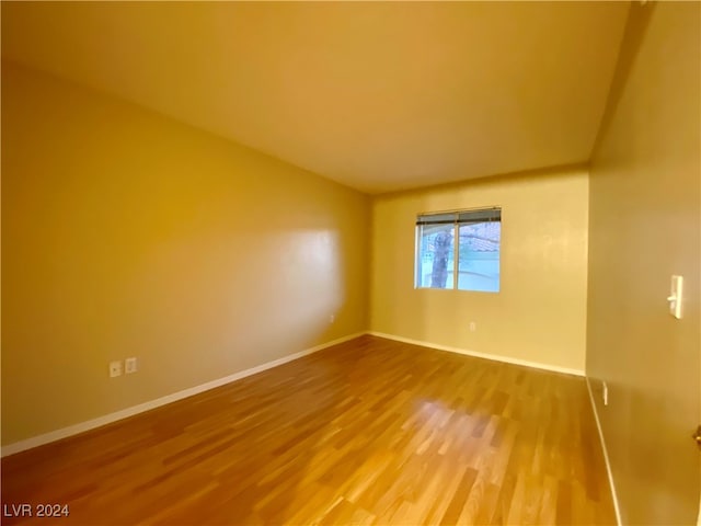 spare room featuring hardwood / wood-style floors