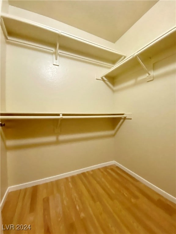 walk in closet featuring wood-type flooring