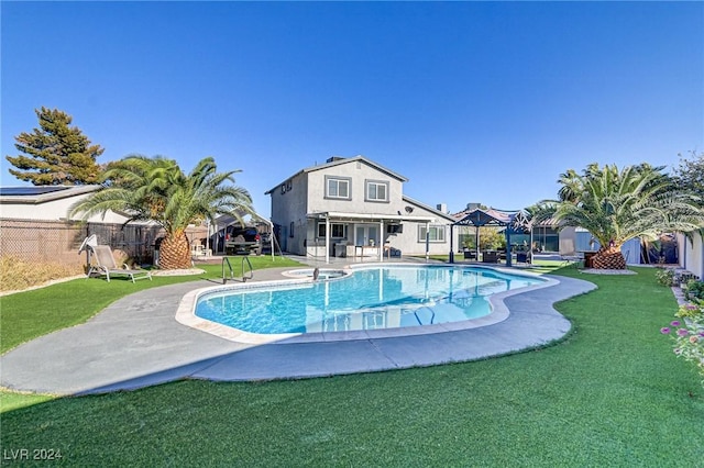 view of pool featuring fence, a gazebo, a yard, a fenced in pool, and a patio area