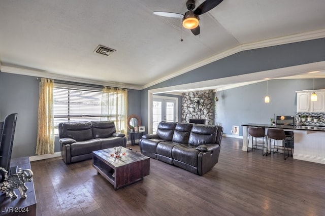 living room with ceiling fan, ornamental molding, french doors, vaulted ceiling, and dark hardwood / wood-style flooring