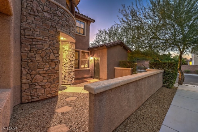 view of patio terrace at dusk