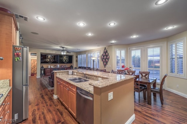 kitchen featuring dark wood-style floors, visible vents, stainless steel appliances, and a sink