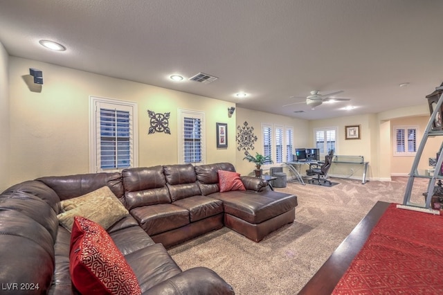 living room featuring carpet floors and ceiling fan