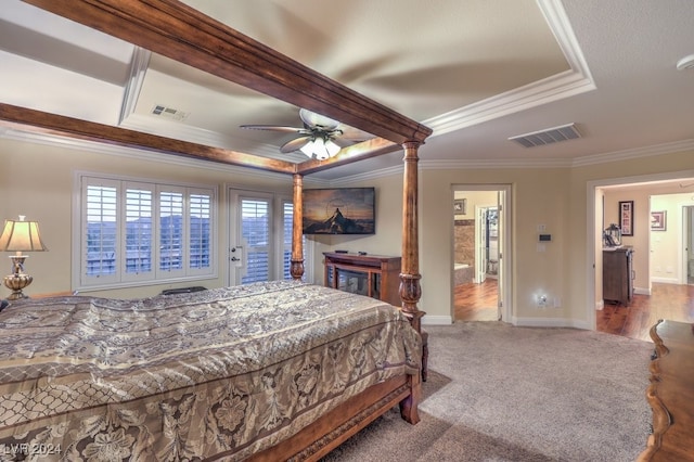 carpeted bedroom featuring ceiling fan, ornamental molding, and a raised ceiling