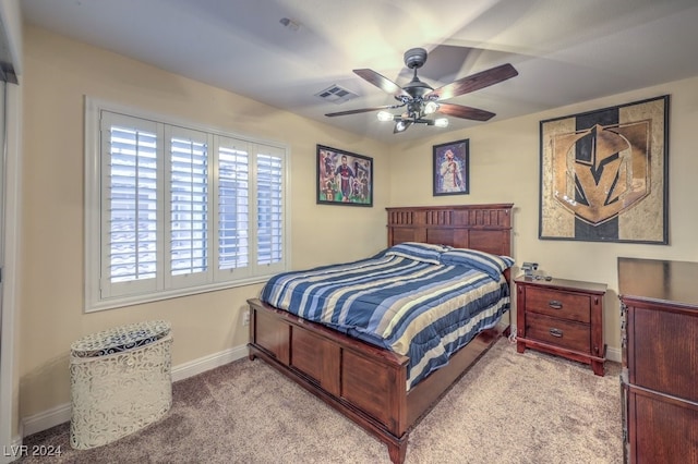 bedroom with visible vents, carpet flooring, baseboards, and ceiling fan