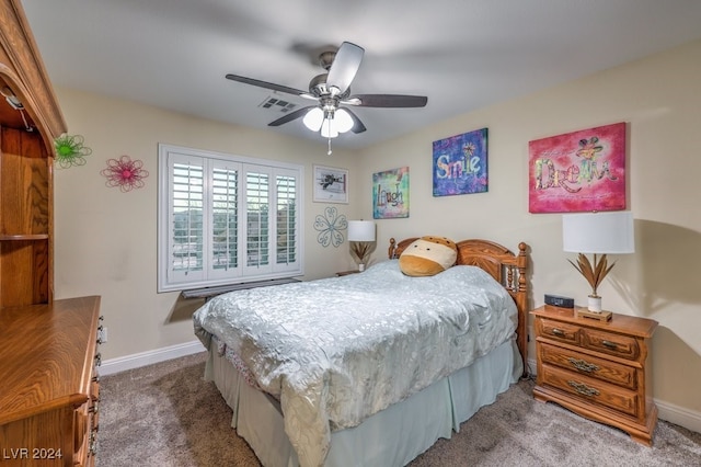 bedroom featuring carpet flooring, ceiling fan, visible vents, and baseboards