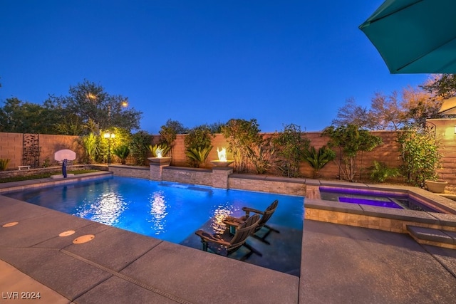 view of swimming pool featuring a fenced in pool, an in ground hot tub, and a fenced backyard