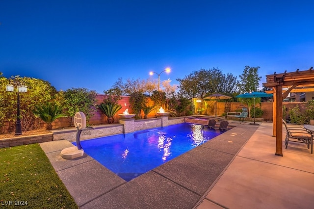 pool at dusk with a pergola, pool water feature, an in ground hot tub, and a patio