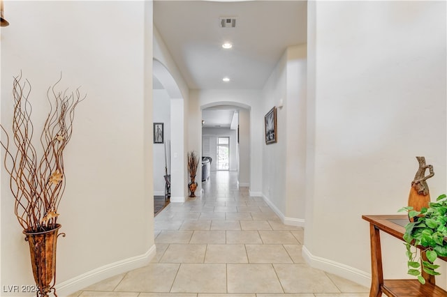 hallway with light tile patterned floors