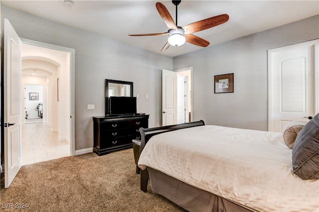 carpeted bedroom featuring ceiling fan