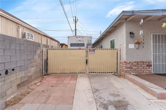 view of gate featuring fence