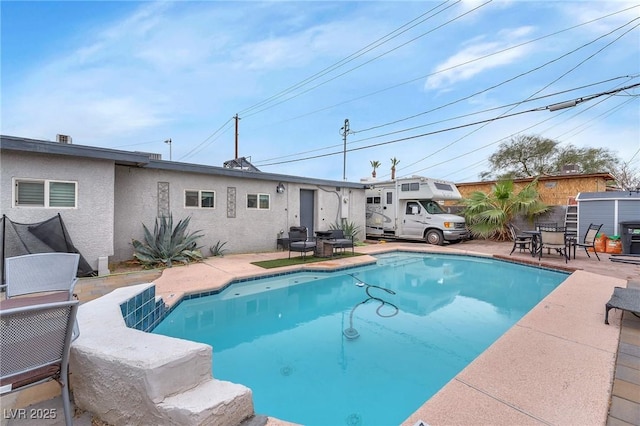 view of pool featuring a patio area and a fenced in pool