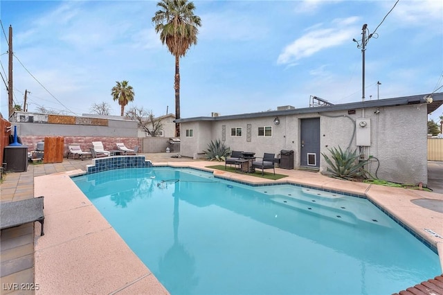 view of pool with a fenced in pool, a patio, and fence