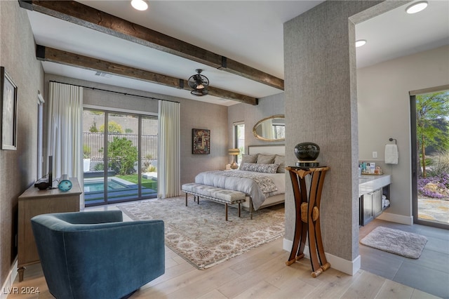 bedroom featuring beamed ceiling, access to outside, and light hardwood / wood-style floors