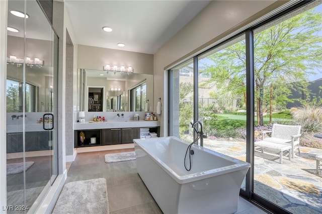 bathroom featuring vanity and separate shower and tub