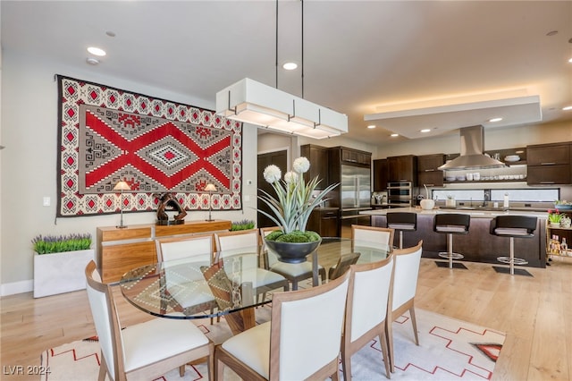 dining room with light hardwood / wood-style floors