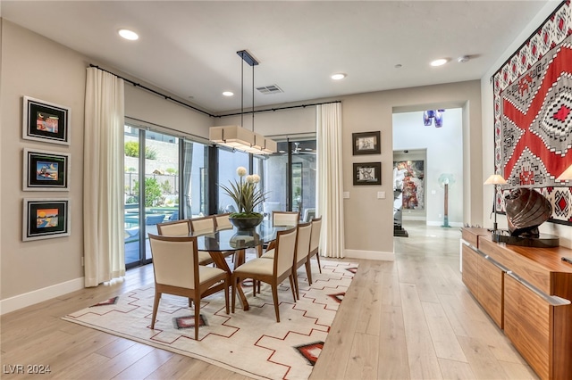 dining area featuring light wood-type flooring