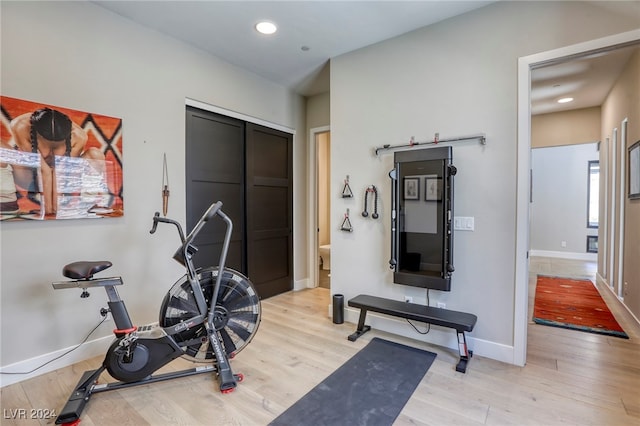 workout area featuring light wood-type flooring