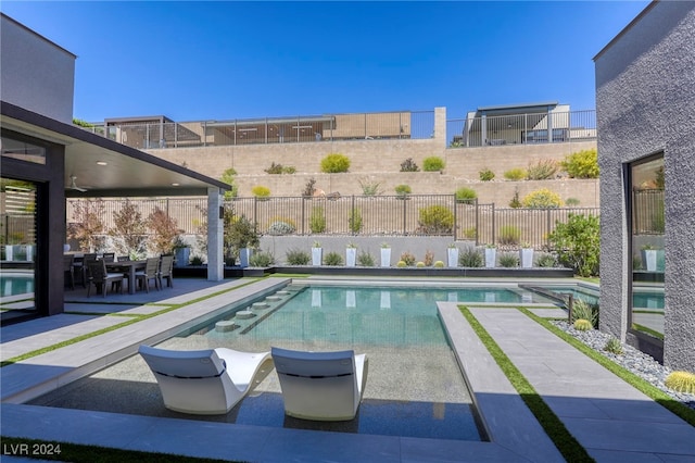 view of swimming pool with a patio