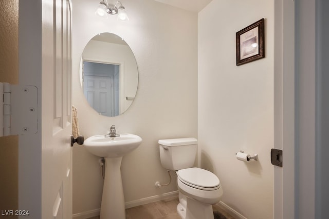 bathroom with toilet and sink