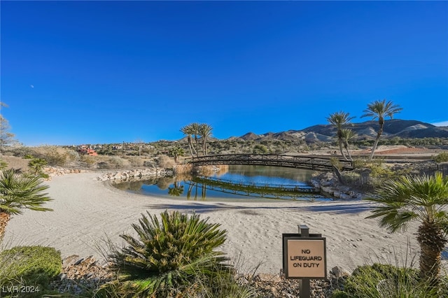 exterior space with a water and mountain view