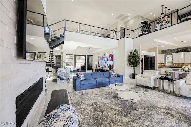 living room with a towering ceiling