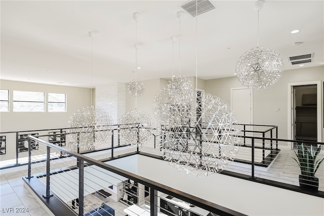 interior space with an inviting chandelier and light tile patterned floors