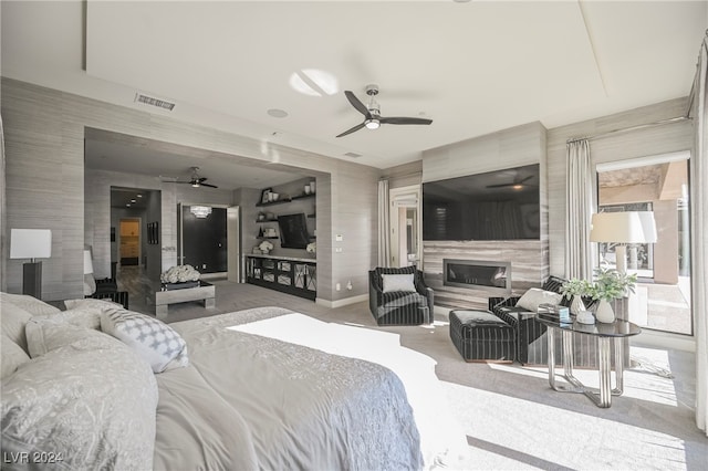 bedroom featuring ceiling fan and light carpet