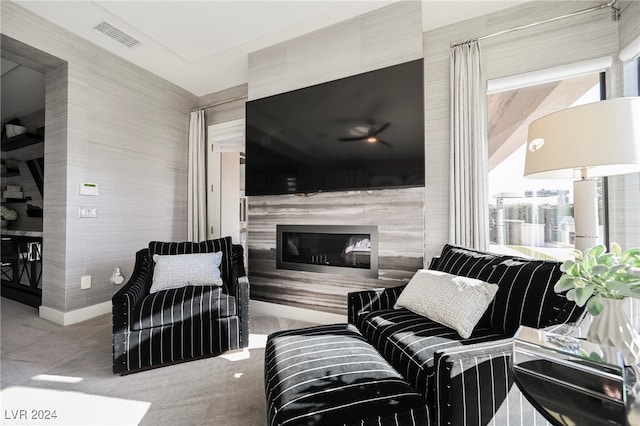 carpeted living room featuring plenty of natural light