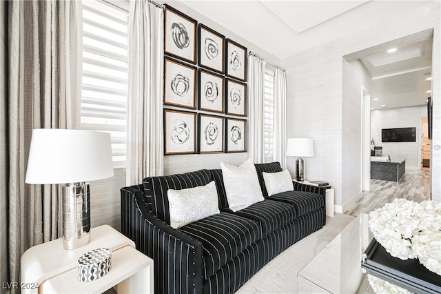 living room featuring light hardwood / wood-style flooring and a healthy amount of sunlight