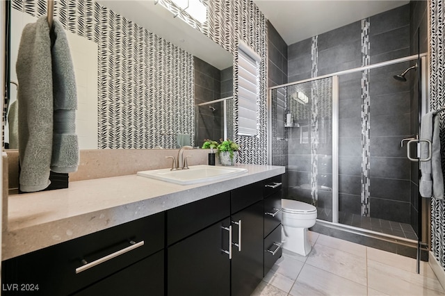 bathroom with an enclosed shower, tile patterned flooring, toilet, and vanity