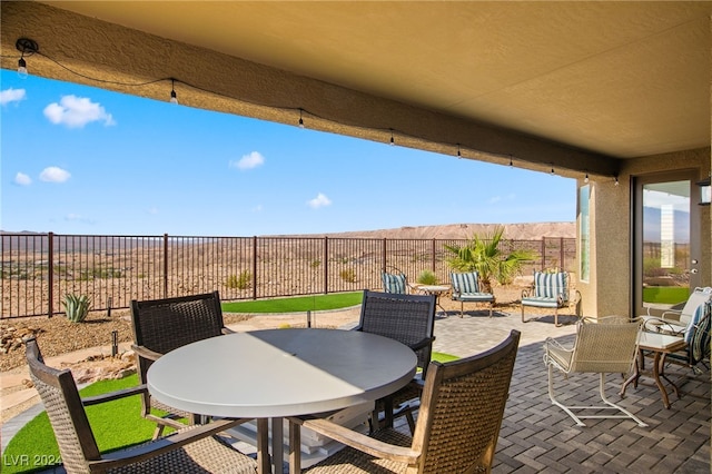 view of patio with a mountain view