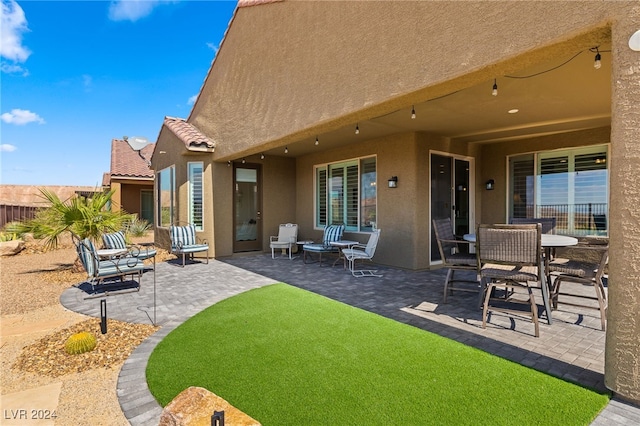 rear view of house with a patio area