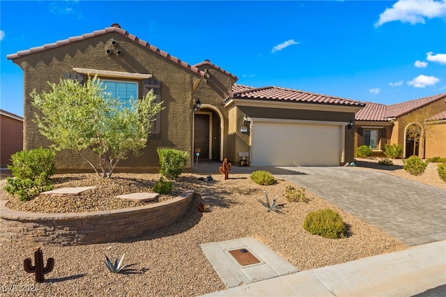 mediterranean / spanish-style house featuring a garage