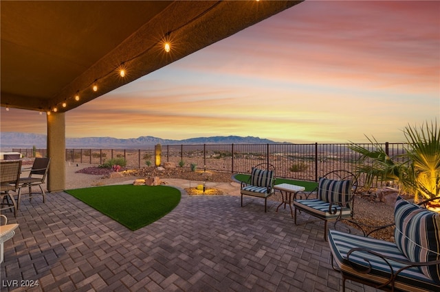 patio terrace at dusk with a mountain view