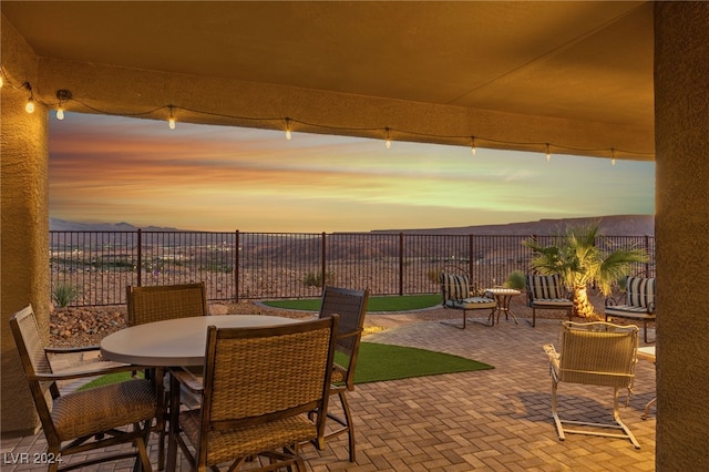 view of patio terrace at dusk