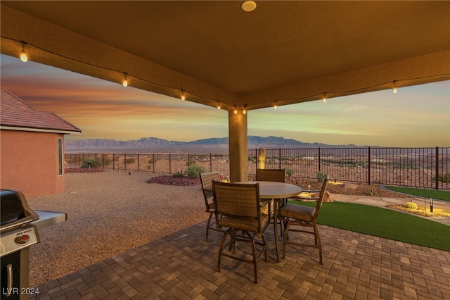 patio terrace at dusk with a mountain view