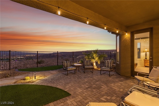 view of patio terrace at dusk