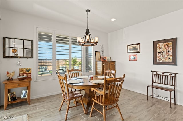 dining area with an inviting chandelier