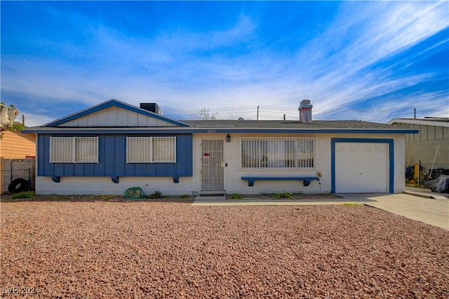 ranch-style house featuring a garage