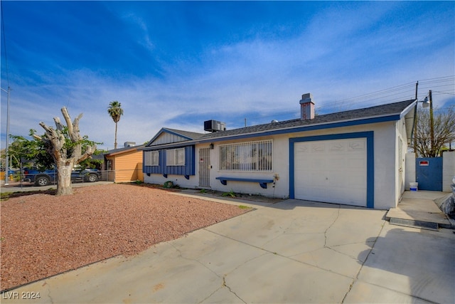 single story home with a garage