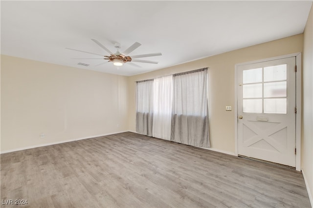 spare room featuring ceiling fan and light wood-type flooring