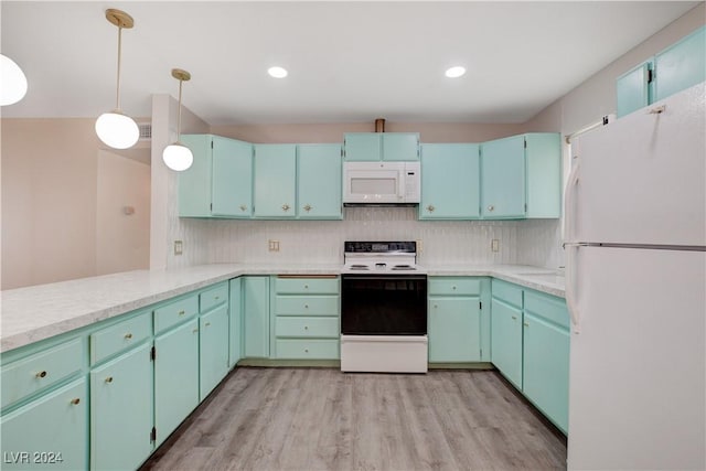 kitchen with white appliances, light wood-style floors, and backsplash