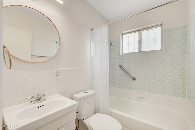 full bathroom with vanity, toilet, tile walls, tasteful backsplash, and shower / tub combo