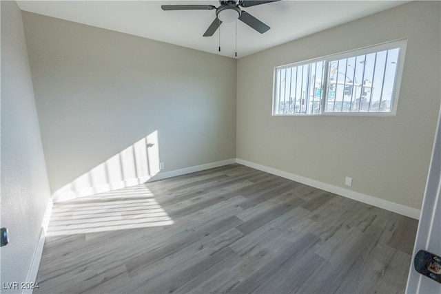 unfurnished room with wood-type flooring and ceiling fan