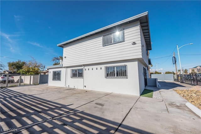 back of property featuring a patio