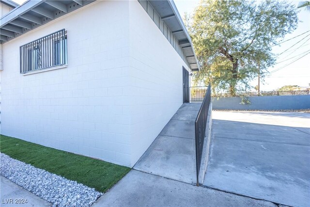 view of property exterior with a patio area