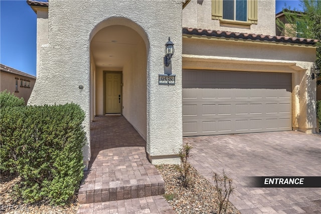 property entrance with a garage