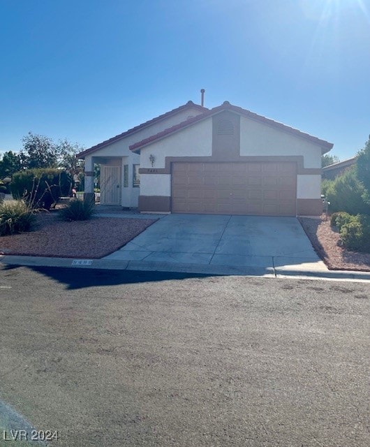 ranch-style home featuring a garage