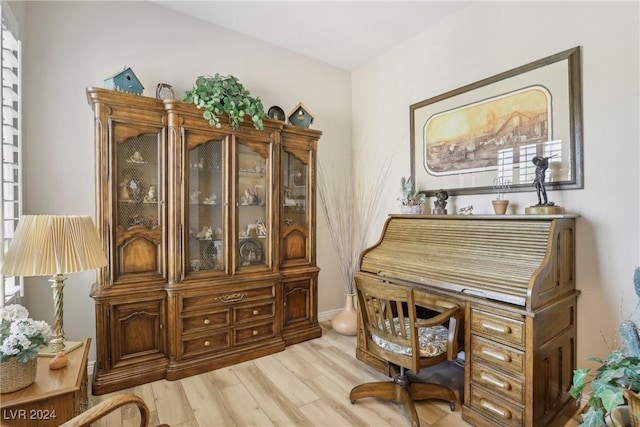 office area with light hardwood / wood-style flooring